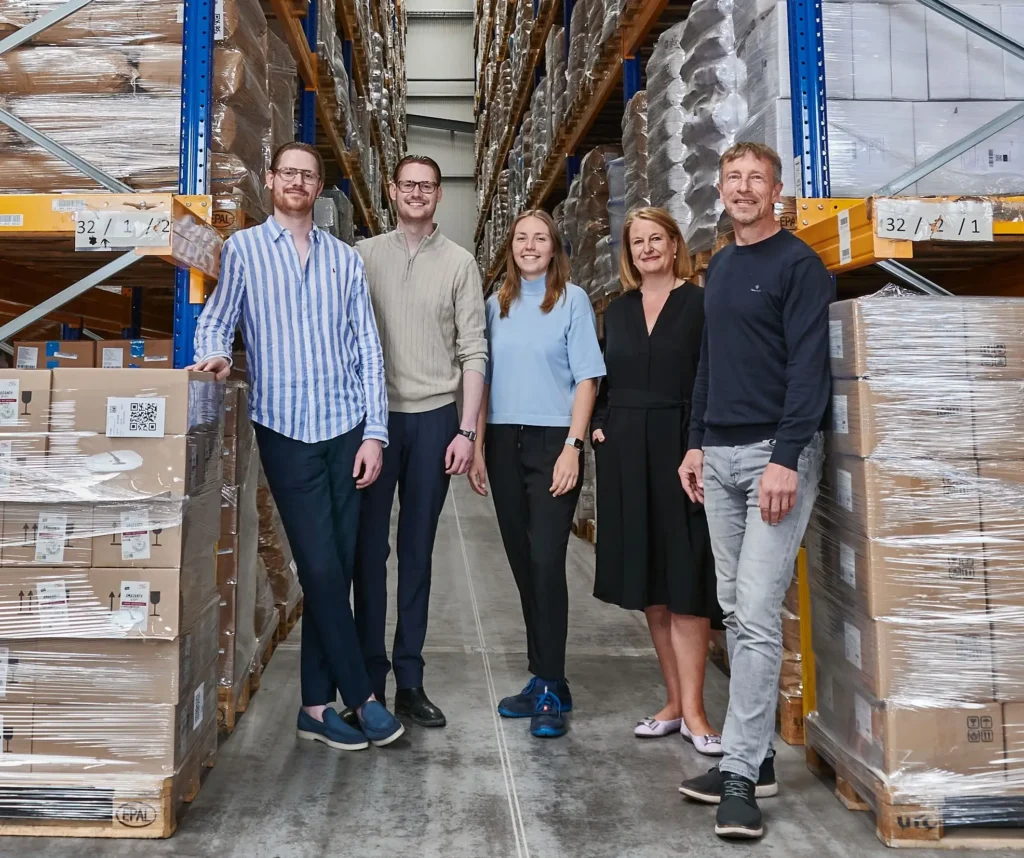 Five members of the Bode family in an aisle of the high-bay warehouse