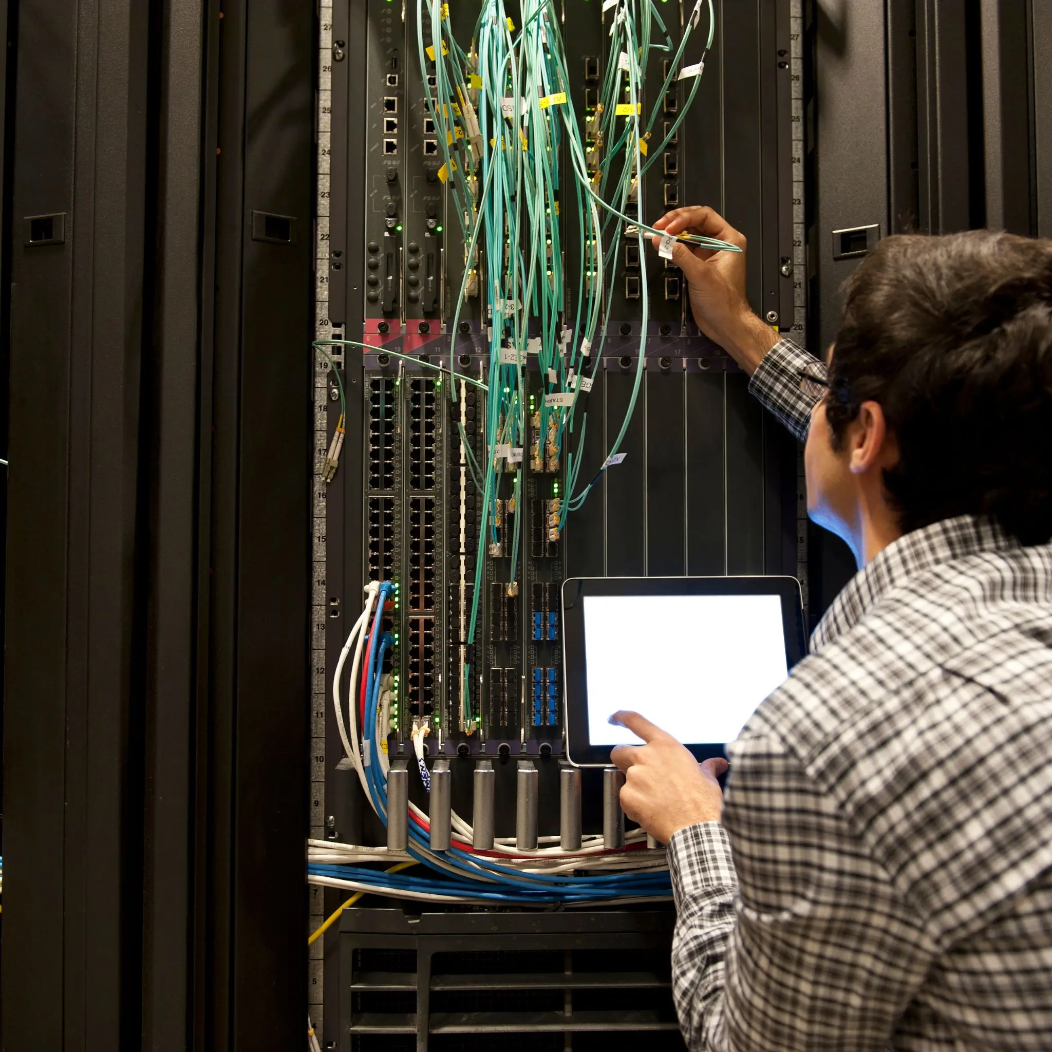 IT employee working on wiring