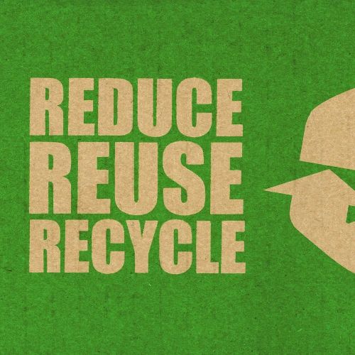 A section of a printed cardboard box with the words reduce, reuse, recycle